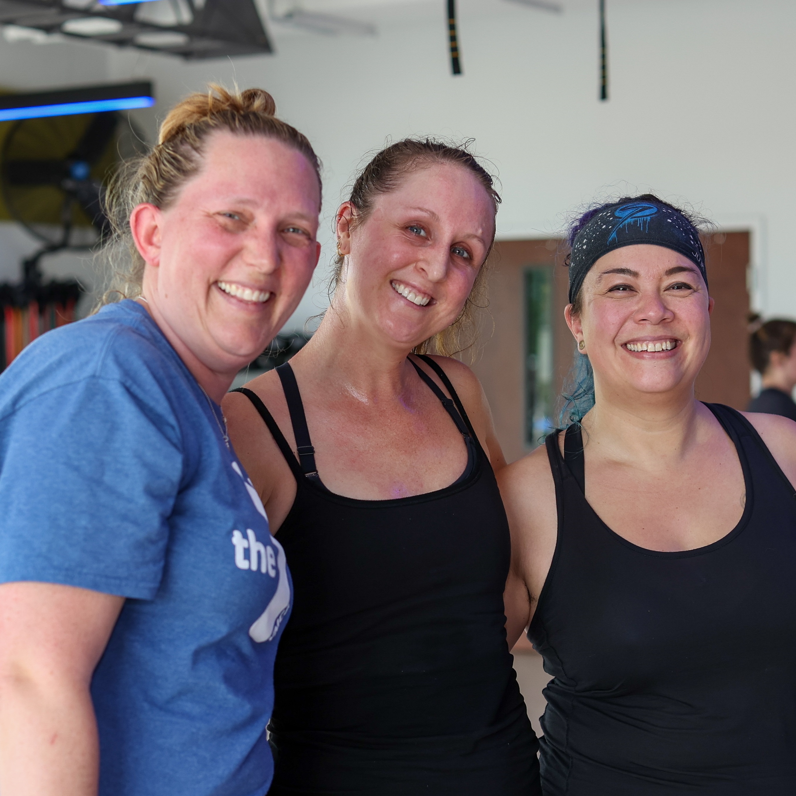 three Y members smiling after a fitness class 