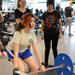 Teens working out in the Health & Wellness Center