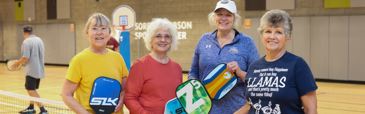 active older women play pickleball in the eugene ymca gym