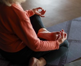 woman meditating in eugene ymca yoga studio