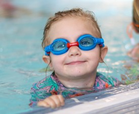 Happy child at swim lessons